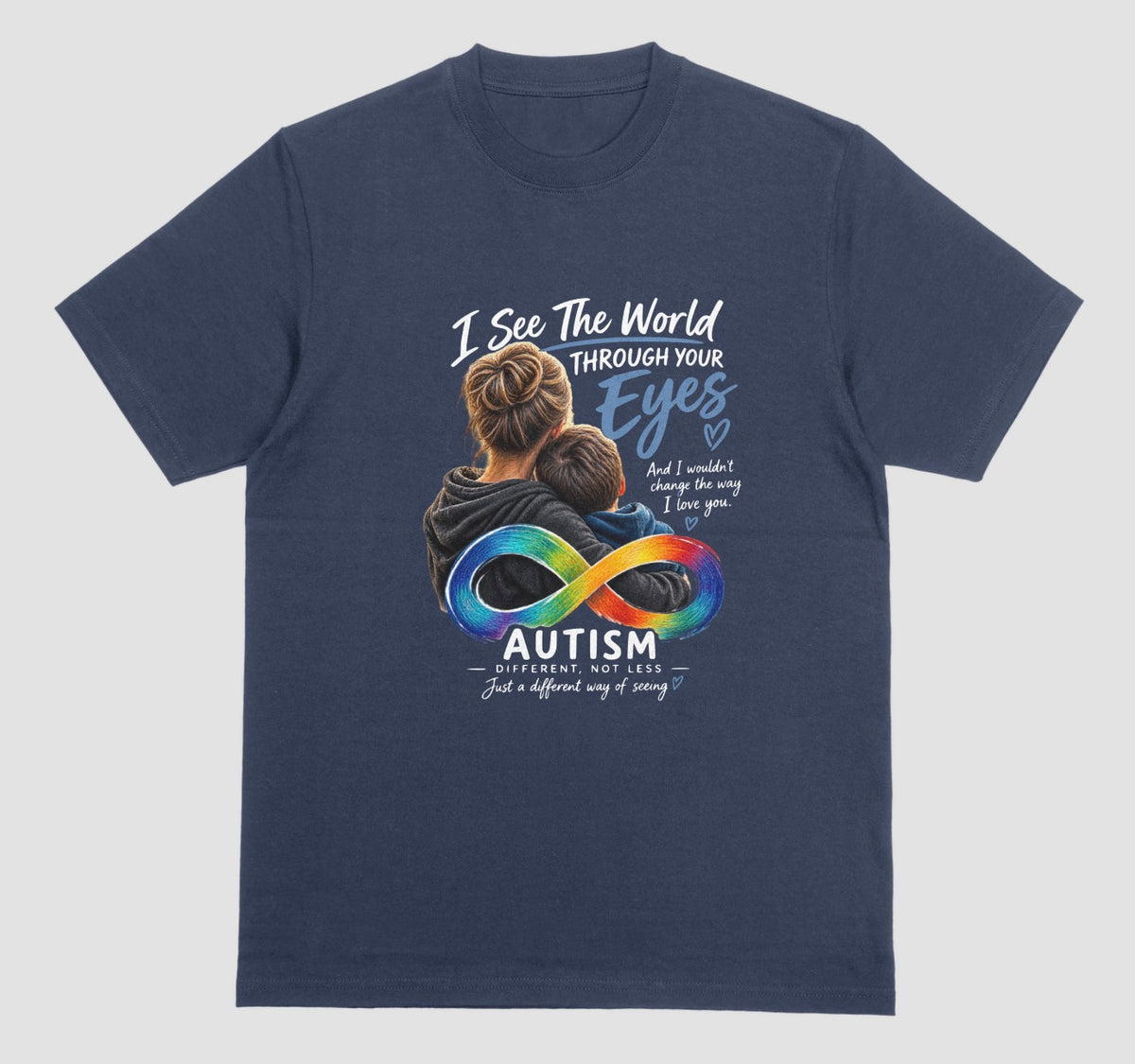 A navy blue t-shirt with a graphic of a parent hugging a child, a rainbow infinity symbol, and the text ‘I See the World Through Your Eyes’ and ‘Autism: Different, Not Less.’