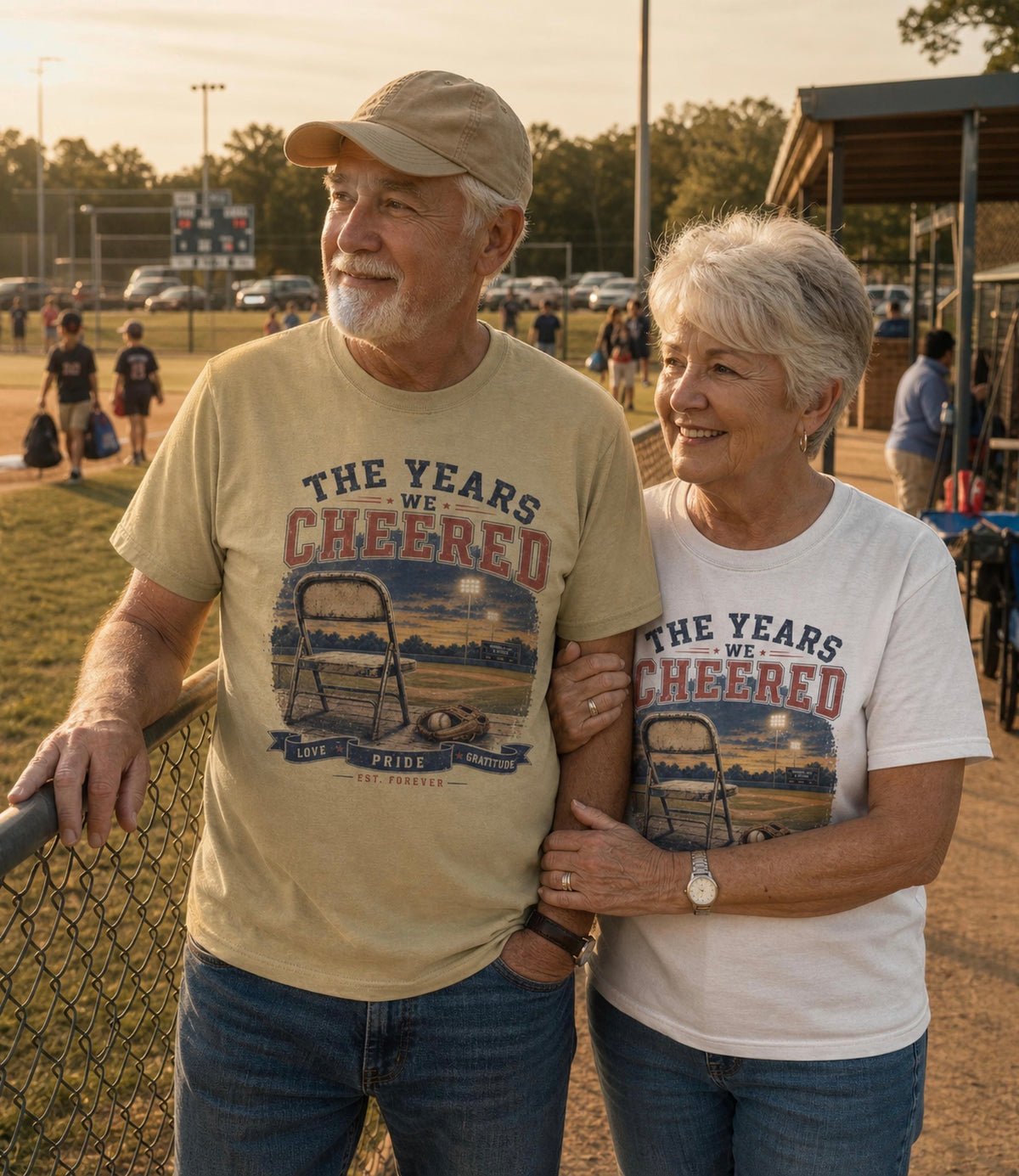 Grandparents lifestyle — "Grandparents wearing The Years We Cheered baseball shirt celebrating youth baseball family memories"
Lifestyle — "The Years We Cheered baseball shirt lifestyle photo celebrating youth baseball family and seasons"