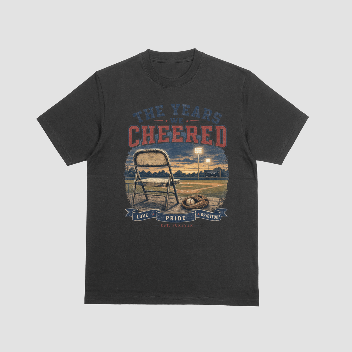 Black — "The Years We Cheered baseball t-shirt in black featuring a folding chair, baseball glove, and field graphic with Love, Pride, Gratitude banner"